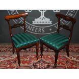 A set of eight 19th Century rosewood dining chairs, with acorn and scroll carved horizontal slats,