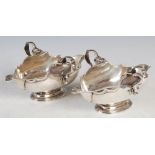 A pair of Edwardian silver double lipped sauce boats, maker C S Harris & Sons Ltd, London 1904, of