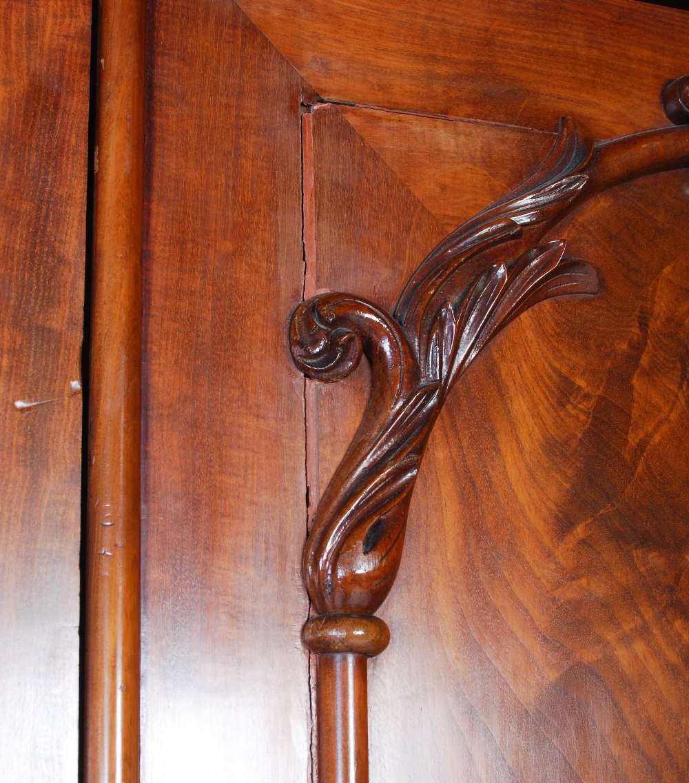 A late 19th century mahogany triple section wardrobe, with a rectangular cavetto pediment atop three - Image 5 of 6