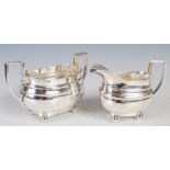 A George V silver sugar bowl and cream jug, Sheffield, 1925, makers mark of W. Hutton & Sons, oval