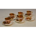 A set of five Royal Worcester coffee cups and six saucers decorated by Harry Stinton, dated 1924/