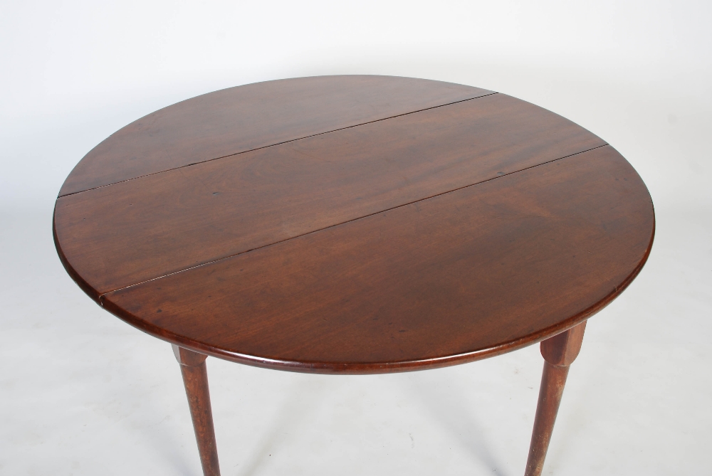 A George II mahogany dining table, circa 1740-60, the oval drop leaf top on four cabriole legs - Image 5 of 7