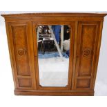 A late Victorian oak, walnut, and burr walnut triple section wardrobe, with a gadrooned pediment