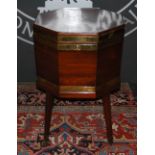 A George III mahogany and brass bound octagonal cellarette on stand, the hinged top opening to