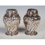 Pair of late 19th century London silver sugar shakers, with detachable pierced cover and embossed