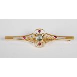 An early 20th century yellow metal, aquamarine, ruby and split pearl brooch, centred with a round