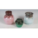 A group of three small Monart vases, comprising; a shape N vase mottled purple and pink with gold