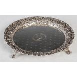An American silver salver by S. Kirk & Son Co., the sole centred with initials in a foliate border