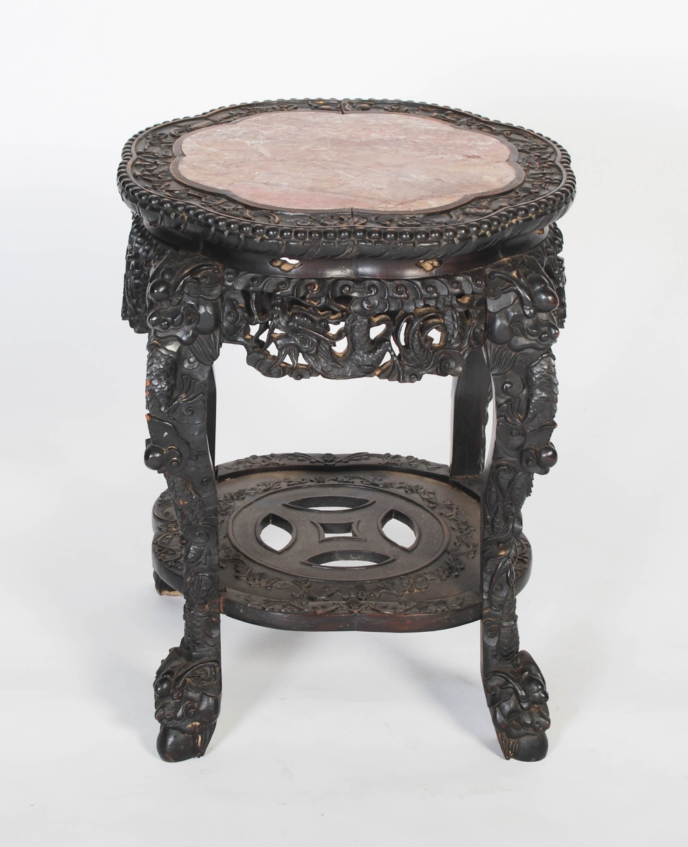 A Chinese carved darkwood stand, Qing Dynasty, the round top carved with a frieze of auspicious - Image 7 of 7
