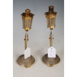 Pair of early 20th century yellow and white metal novelty cigar lighters in the form of street
