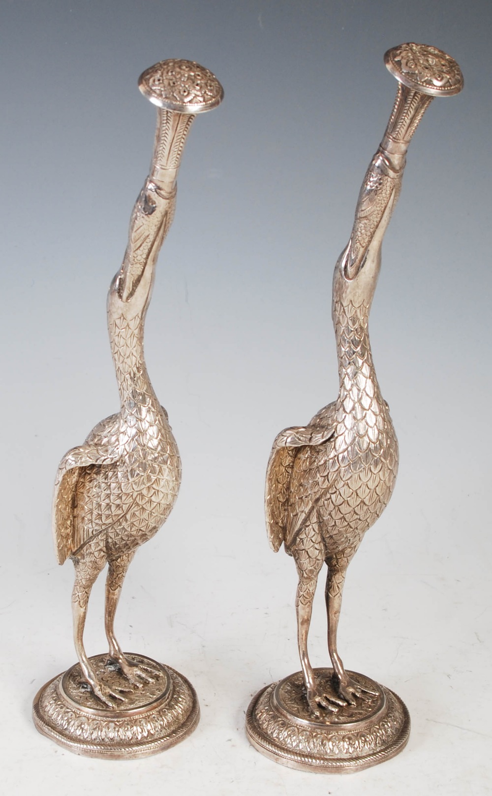 A pair of 19th century Indian silver rosewater sprinklers, modelled as cranes supporting