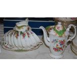 Early 20th century Paragon coffee set, in a green, gilt and floral transfer printed design including
