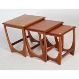 Nest of three 1970's modernist 'G-Plan' teak occasional tables, on long tapering U-shaped supports