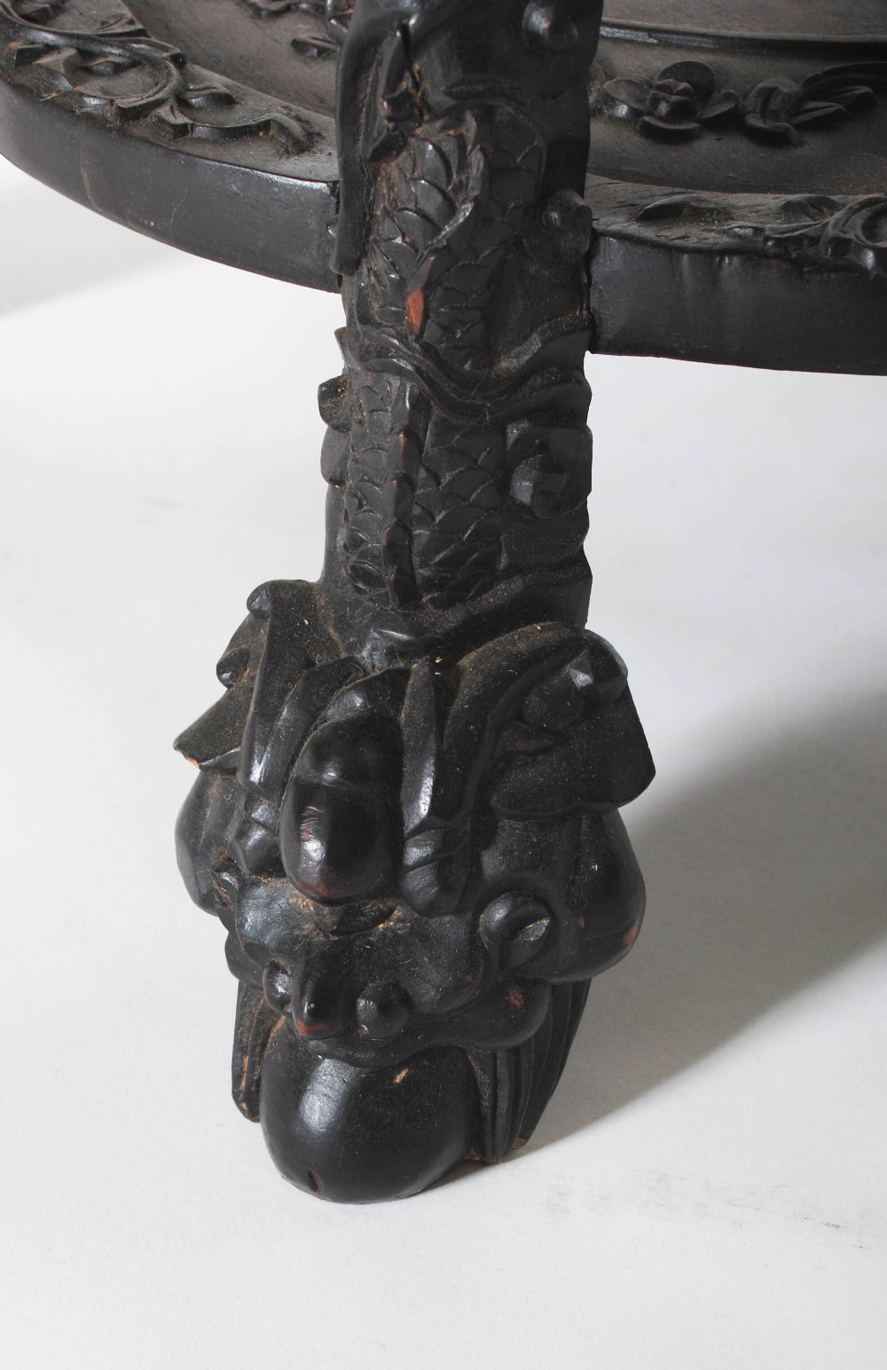 A Chinese carved darkwood stand, Qing Dynasty, the round top carved with a frieze of auspicious - Image 4 of 7