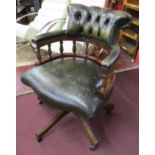 Button-back green leather office chair