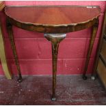 Demi-lune mahogany table on cabriole legs