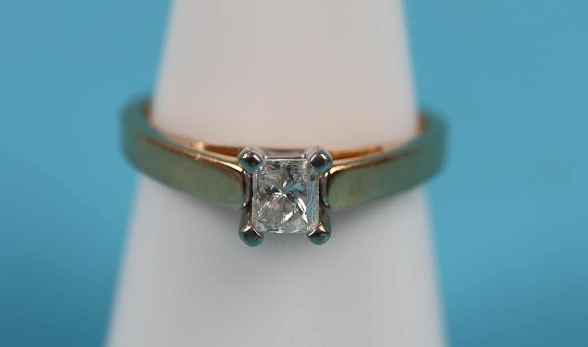 Gold princess cut diamond solitaire ring