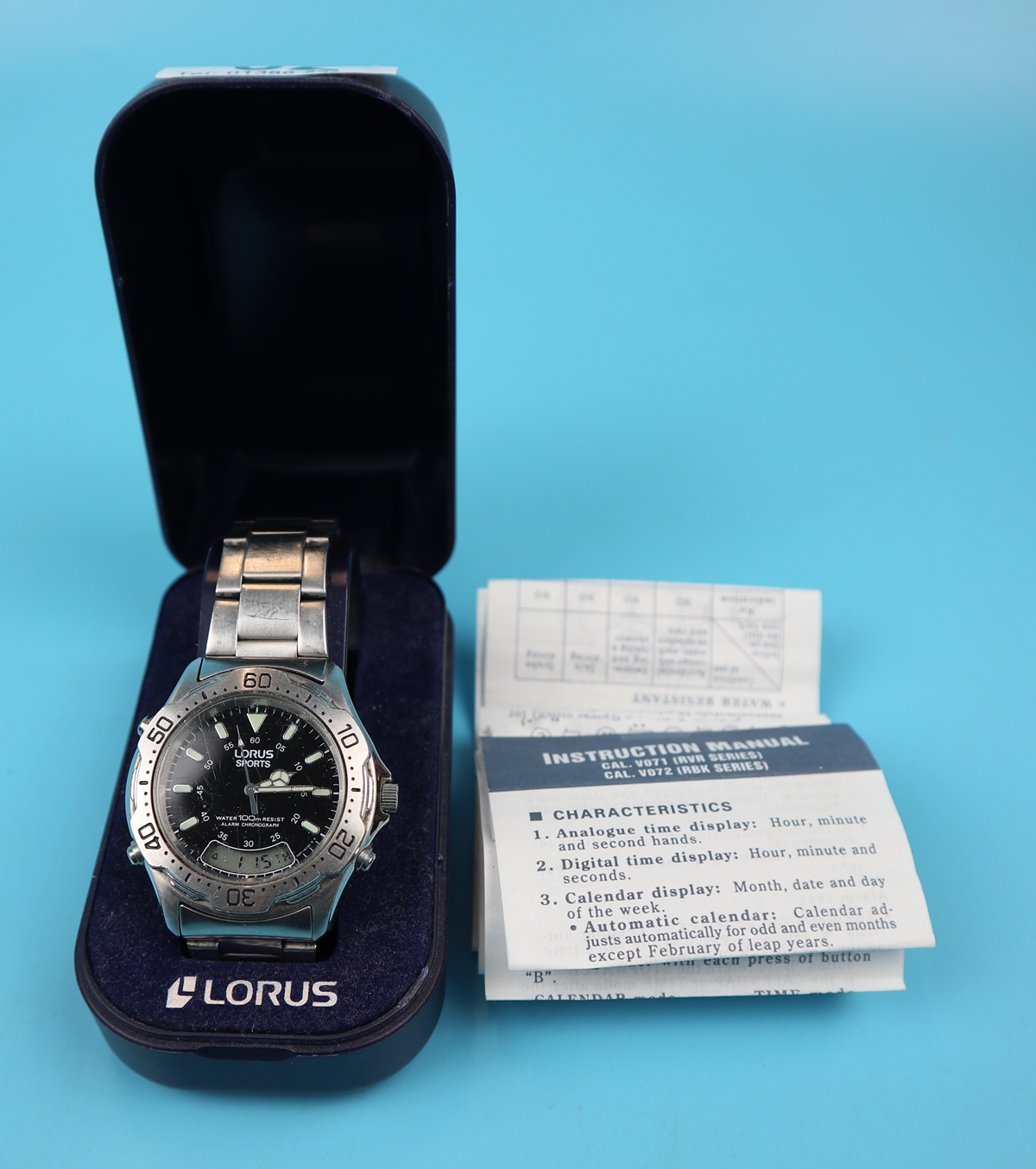 Stainless steel gents Lorus watch in good working order & in original box with paperwork