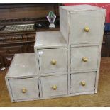 Unusual bank of drawers with cupboard / library steps