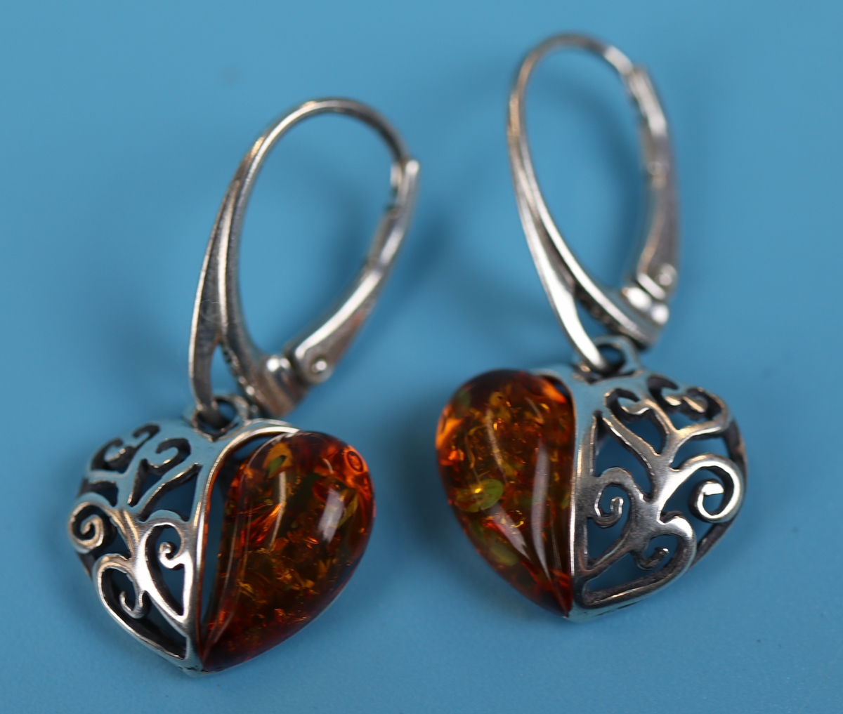 Pair of silver & amber heart earrings