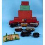 Collection of tin plate O gauge trains & carriages in boxes to include level crossing