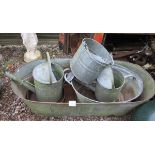 Collection of galvanised items to include bath, buckets and watering can