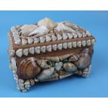 Small trinket box adorned with shells
