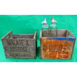 2 bottle crates and 2 soda syphons