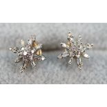 Pair of gold diamond set earrings