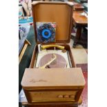 1960's Regentone portable record player with selection of 45rpm records