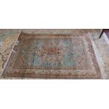 Fine quality signed Turkish turquoise antique silk rug with wildlife themed pattern