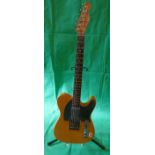 Fender Telecaster style electric guitar with stand
