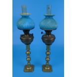 Pair of candlesticks with antique oil lamp fittings