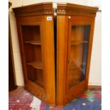 Pair of glazed corner cupboards