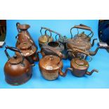 Collection of mostly copper kettles