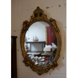 Gilt framed mirror depicting cherubs