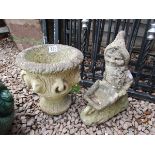 Stone urn and gnome