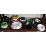 Shelf of pub advertising ashtrays