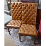 Pair of button back leather dining chairs