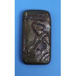 A brass novelty vesta case embossed with the figure of a Japanese Geisha and bamboo on the other