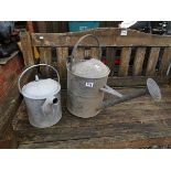 2 galvanised watering cans