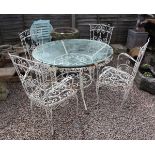 Vintage glass top wrought iron bistro table and 4 chairs with unusual masonic type emblem to rear...