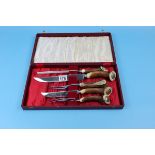 Cased horn handled carving set by Cooper Brothers and Sons of Sheffield