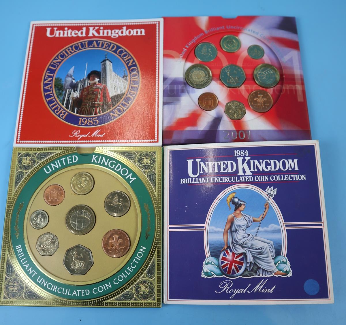 4 sets of uncirculated coins in original Royal Mint packs - 1984,1985,1999,2001