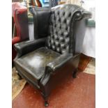 Black leather wing back & button back armchair