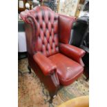 Red leather wing back & button back armchair