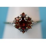 Gold garnet & diamond set ring