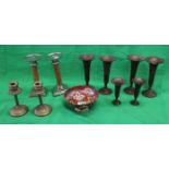 Collection of brass candlesticks, bud vases etc