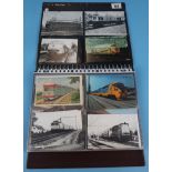 Folder of over 100 railway themed postcards