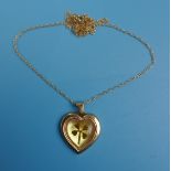 Gold heart pendant on gold chain